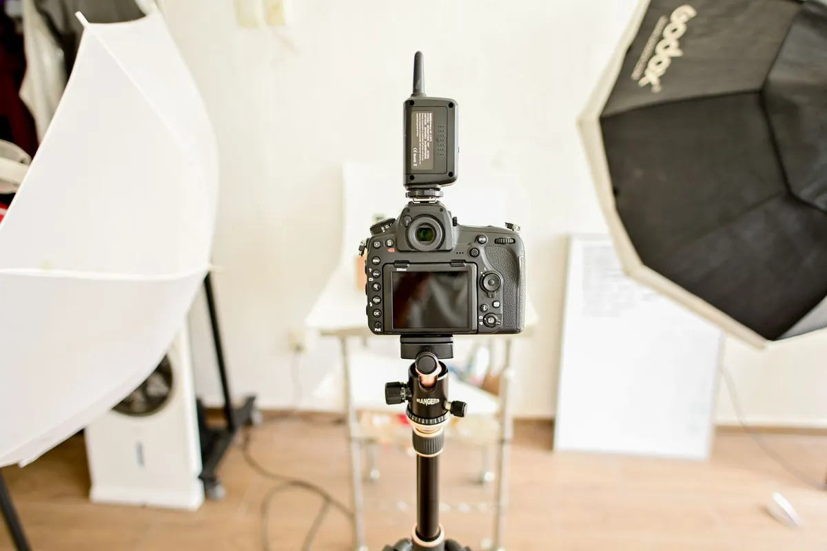 A sleek photo booth camera ready to capture moments at an event, enhancing the guest experience.